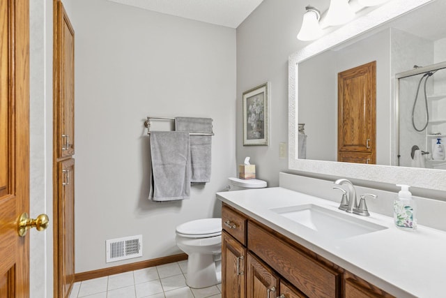 bathroom featuring visible vents, toilet, a stall shower, tile patterned floors, and vanity