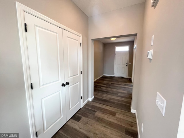 corridor featuring dark hardwood / wood-style flooring