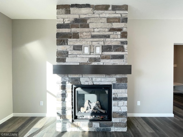 details with a fireplace and hardwood / wood-style flooring