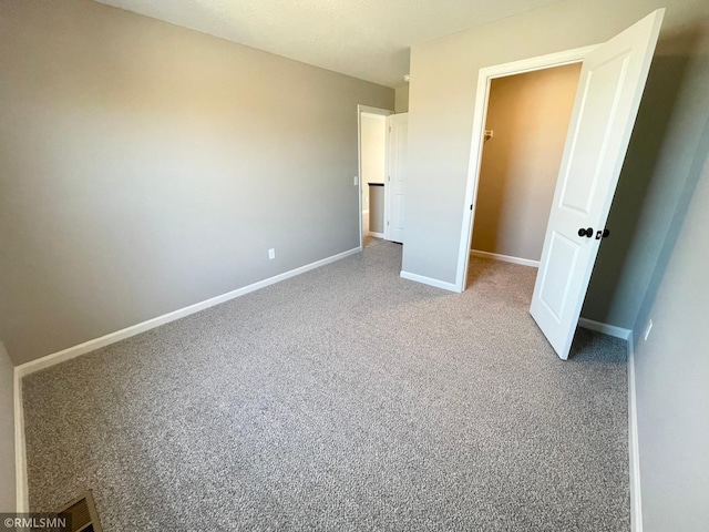 unfurnished bedroom featuring carpet flooring