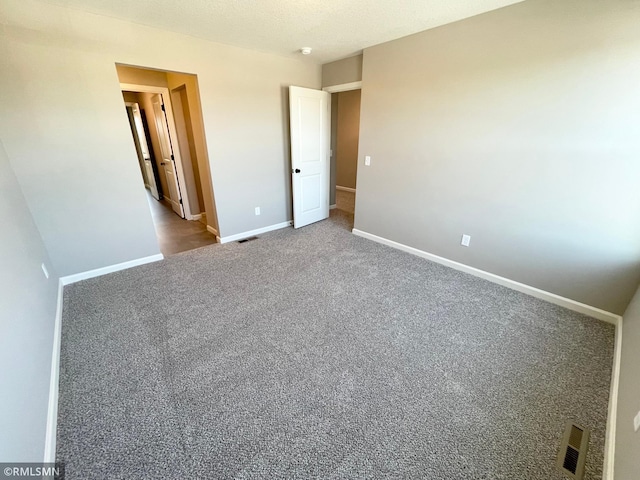 unfurnished bedroom with carpet flooring