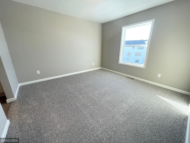 empty room featuring carpet flooring