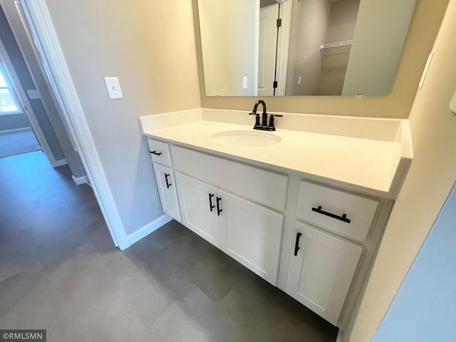 bathroom featuring vanity and concrete flooring