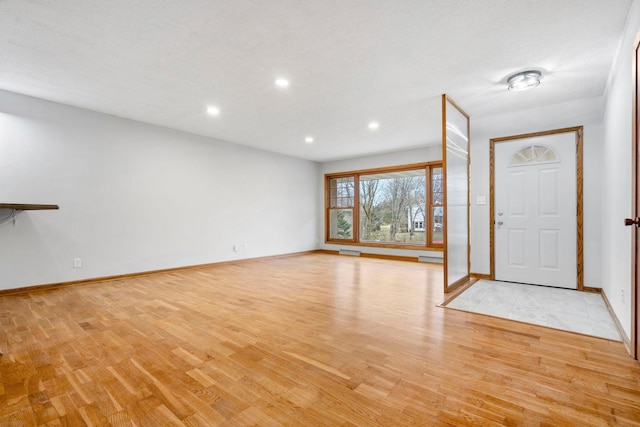 entryway with light hardwood / wood-style flooring