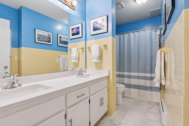 bathroom with baseboard heating, vanity, a textured ceiling, a shower with curtain, and toilet