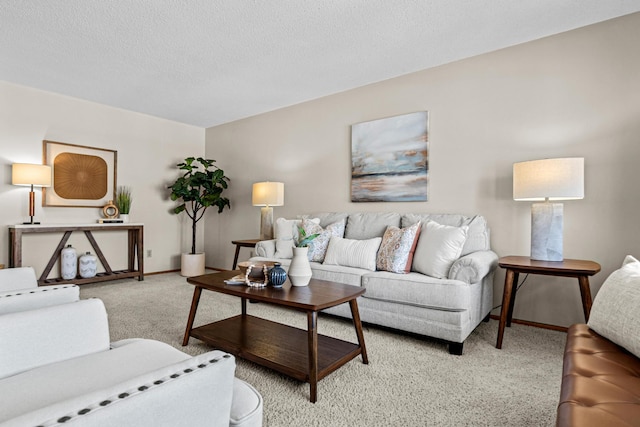 living room featuring light colored carpet and a textured ceiling