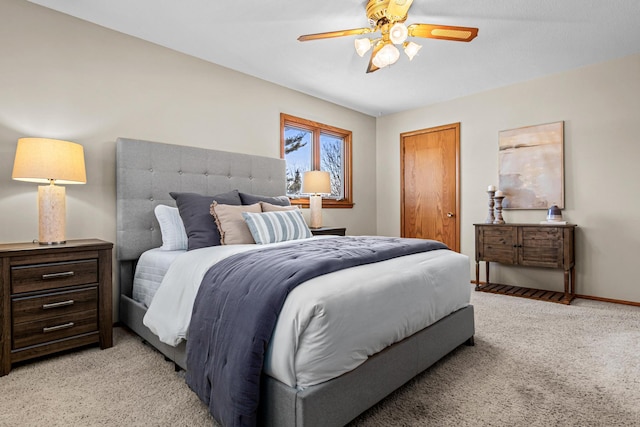 bedroom featuring ceiling fan, light colored carpet, and a closet