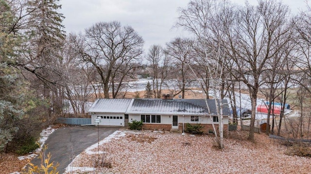 single story home featuring a garage