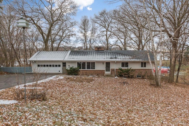 single story home featuring a garage