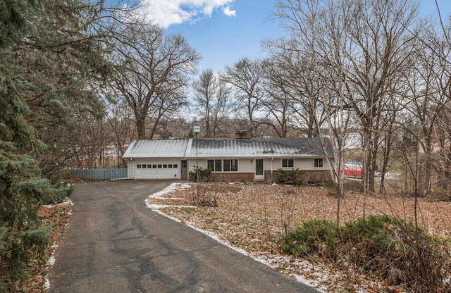 single story home featuring a garage