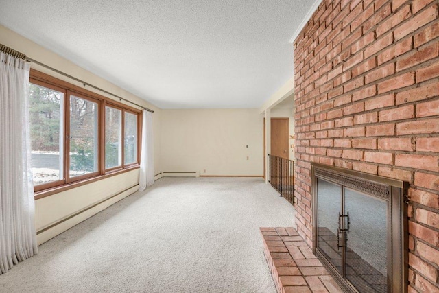 unfurnished living room with a textured ceiling, light colored carpet, a brick fireplace, and baseboard heating