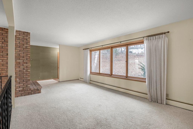 unfurnished living room featuring a fireplace, carpet floors, and a textured ceiling