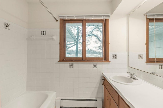 bathroom with vanity, tile walls, and a baseboard heating unit