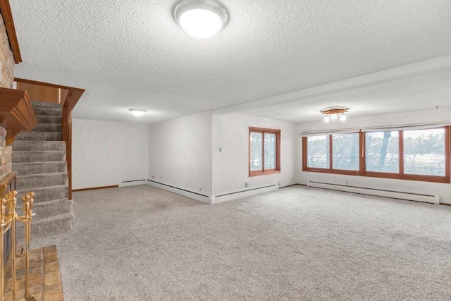 interior space featuring a textured ceiling, carpet flooring, a fireplace, and baseboard heating