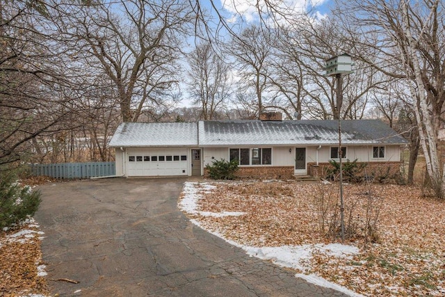 single story home with a garage