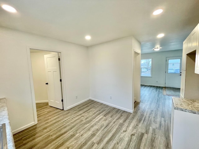 spare room with light wood-type flooring