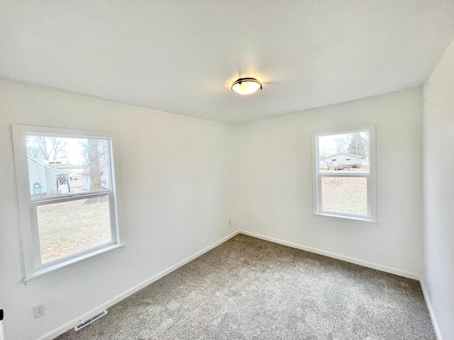 spare room with carpet flooring