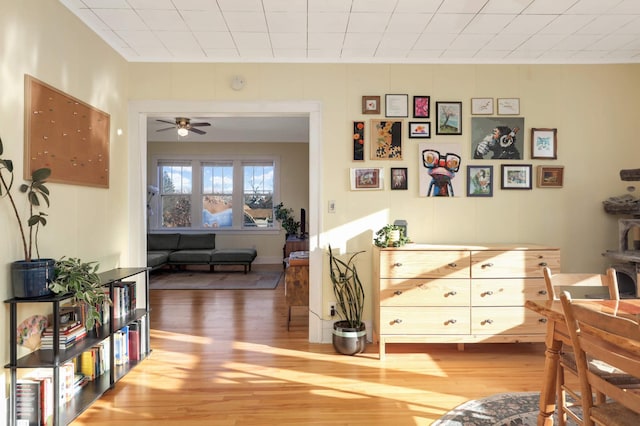 interior space with ceiling fan and wood-type flooring