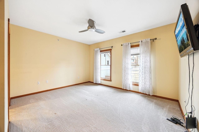 carpeted empty room with ceiling fan