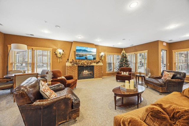 carpeted living room featuring a brick fireplace