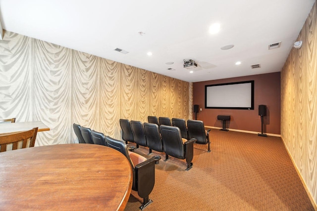 carpeted cinema featuring wood walls