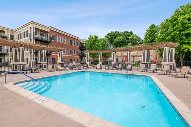 view of swimming pool with a pergola and a patio area