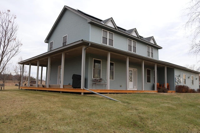 farmhouse-style home with covered porch and a front lawn