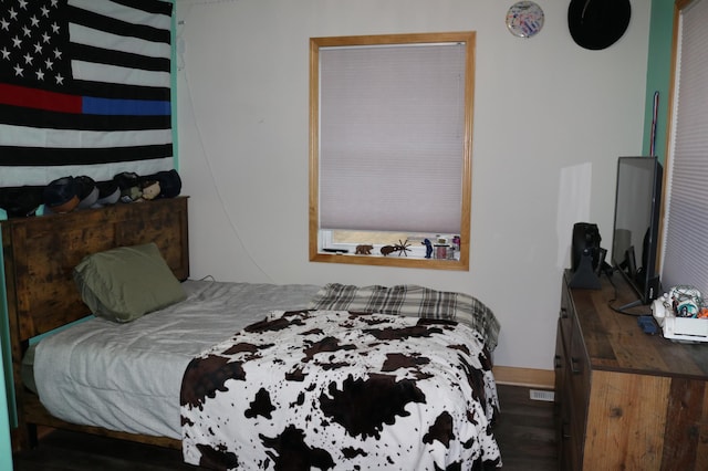 bedroom featuring dark hardwood / wood-style floors