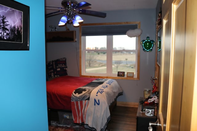 bedroom featuring ceiling fan and wood-type flooring