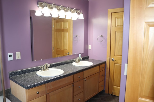 bathroom featuring tile patterned flooring and vanity