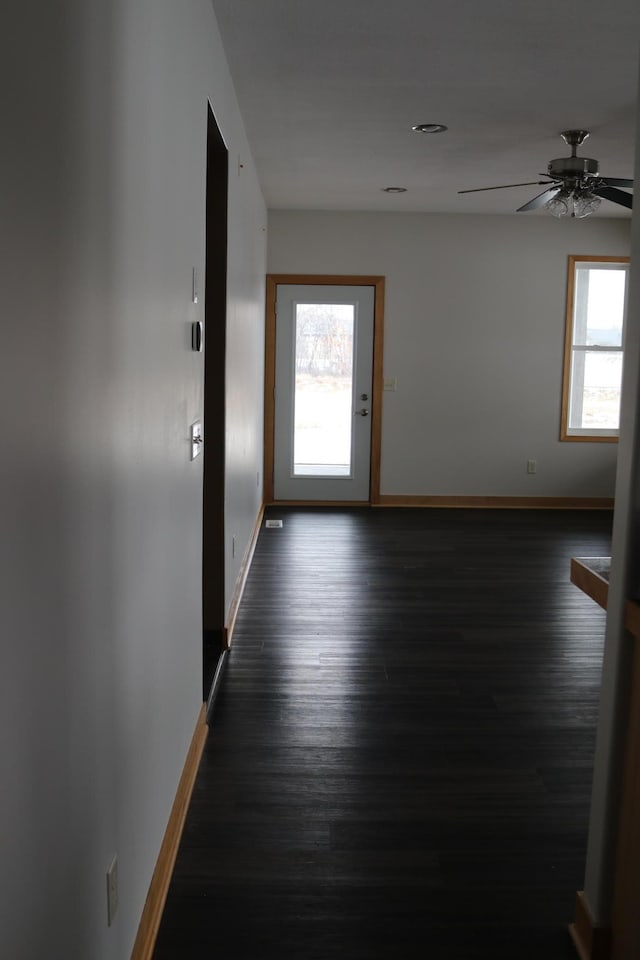 interior space featuring dark hardwood / wood-style flooring and ceiling fan