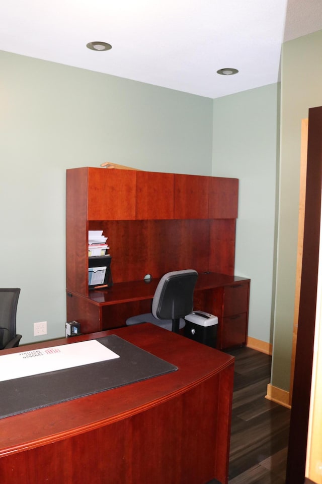 office with dark wood-type flooring