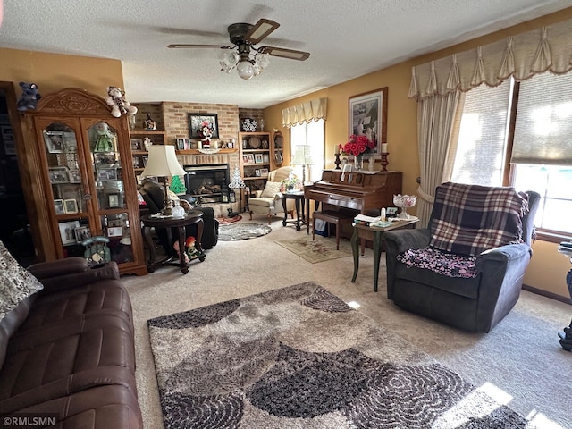 living room with carpet, a textured ceiling, a brick fireplace, and ceiling fan