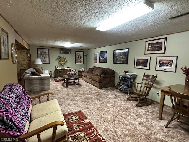 living room featuring carpet flooring and a textured ceiling