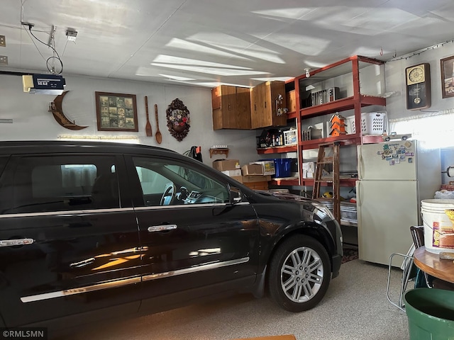 garage featuring white fridge