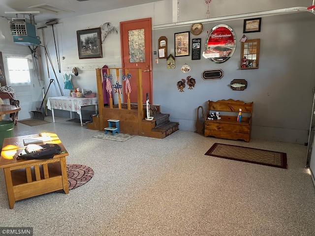 interior space featuring speckled floor