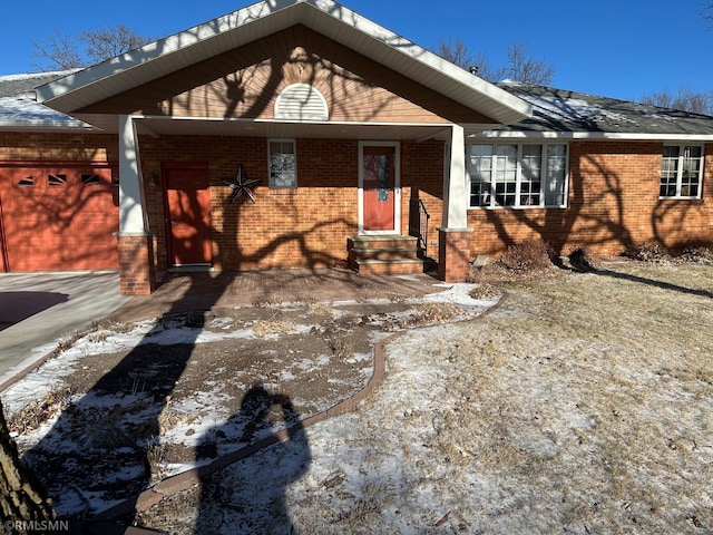 ranch-style house with brick siding and a garage