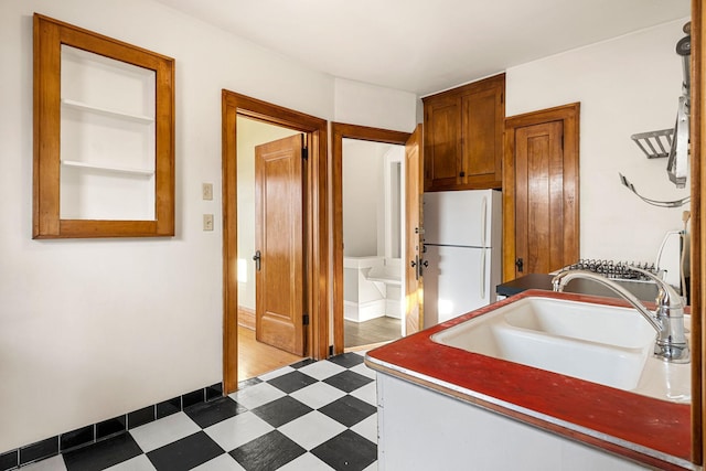 kitchen with white fridge and sink