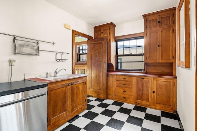 kitchen featuring dishwasher, refrigerator, and sink