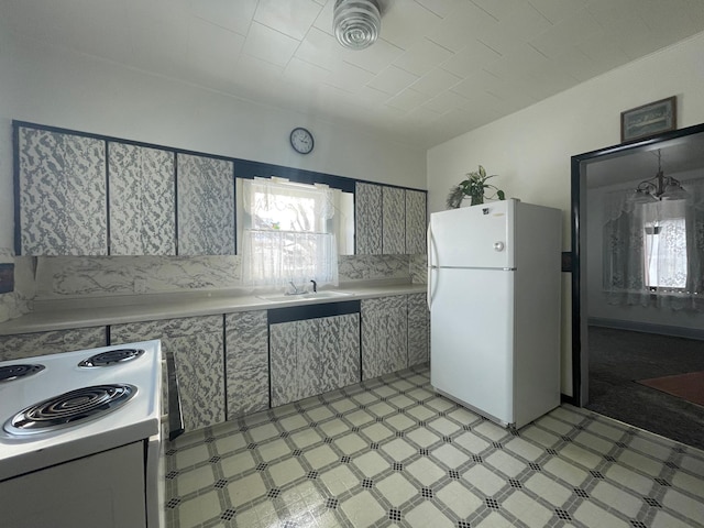 kitchen with white appliances and sink