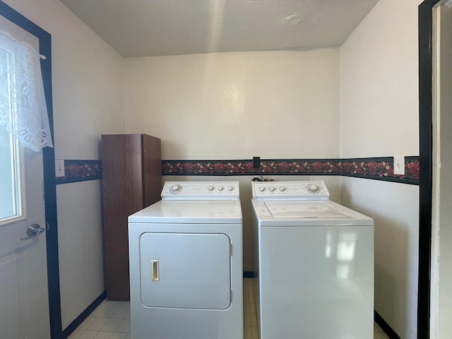 washroom with washer and dryer