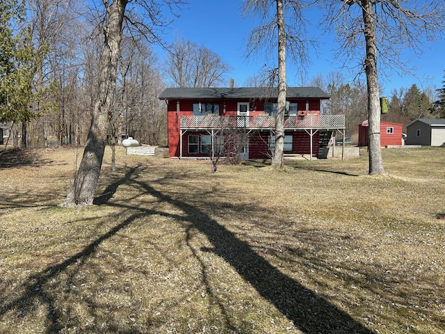 19162 Coho Loop NE, Blackduck, MN 56647 - rear view of property with a lawn and a deck