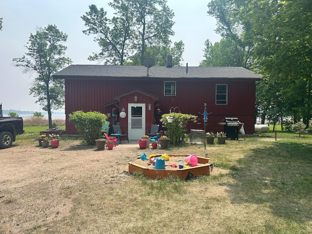 19162 Coho Loop NE, Blackduck, MN 56647 - rear view of property featuring a lawn