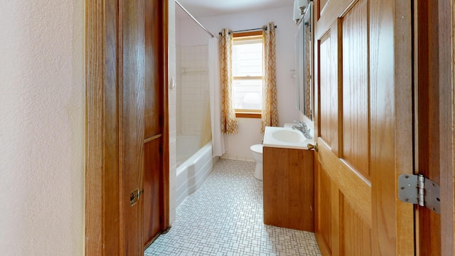 full bathroom with vanity, shower / bath combo, and toilet