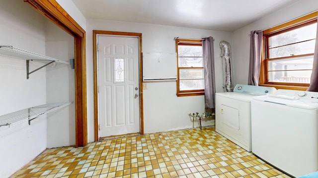 laundry room featuring washer and clothes dryer