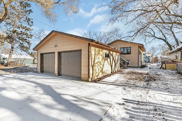 view of snow covered garage