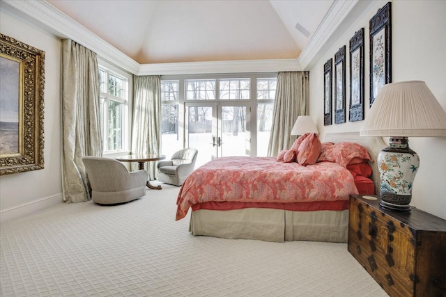 bedroom with crown molding, carpet floors, and vaulted ceiling