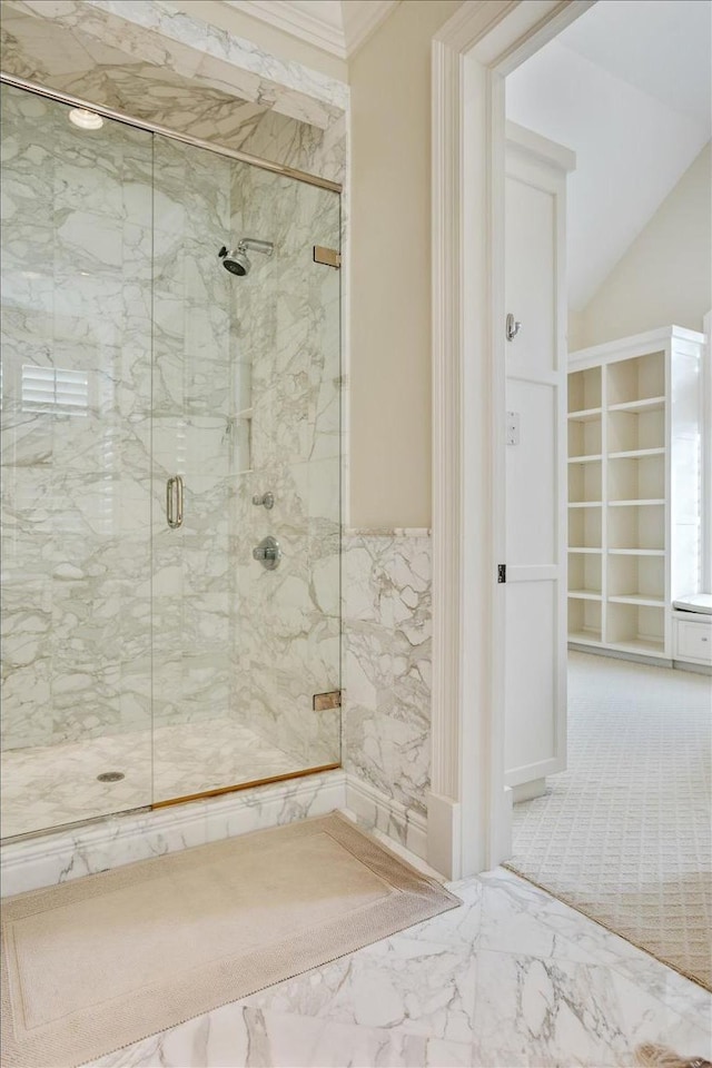 bathroom featuring lofted ceiling and an enclosed shower