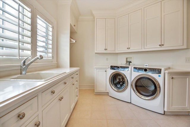 washroom featuring independent washer and dryer, cabinets, ornamental molding, and sink