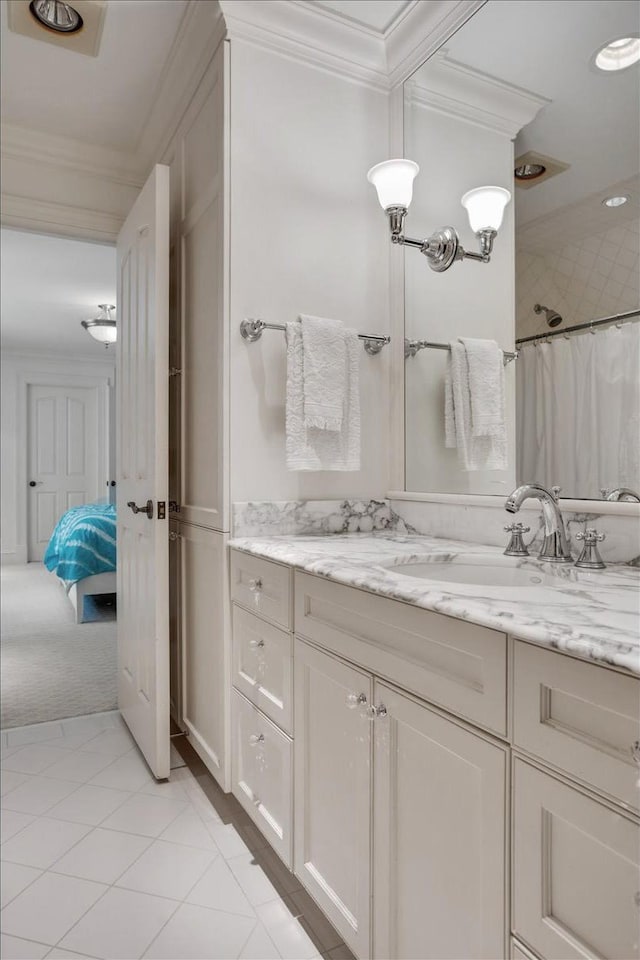 bathroom with vanity, tile patterned floors, curtained shower, and ornamental molding